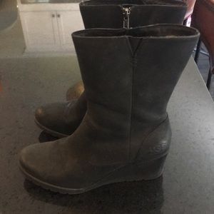 Black suede Ugg platform booties.